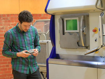 RMIT researcher Dr Alexander Medvedev examines an additive manufactured ballistic target.