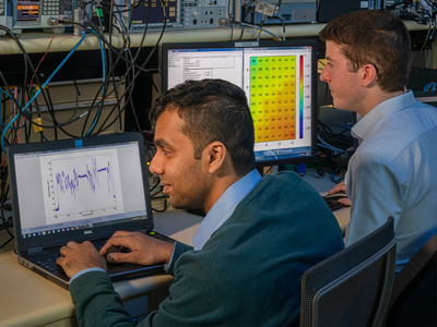 Bathiya Senanayake (left) and an RFTEQ team member developing and testing the new CATJAT system at DSTG Edinburgh.