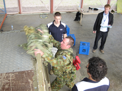 (L-R): Stuart Best, Robert Savage and Daniel Ham compared the value of a generic box lift and place task with task-related assessments such as this pack lift. (L-R): Stuart Best, Robert Savage and Daniel Ham compared the value of a generic box lift and place task with task-related assessments such as this pack lift.