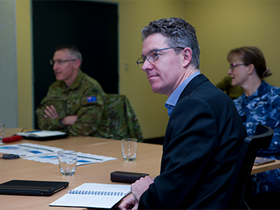 Dr Justin Fidock with Commander of Joint Task Force 629 for Operation COVID-19 Assist, Major General Paul Kenny (left), and Commander Joint Task Group 629.4 Air Commodore Margot Forster receive an update at Keswick Barracks, South Australia.