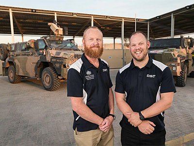Operations analyst Jeff Seers, left, and science and technology liaison officer Matt Randell at the ADF’s main operating base in the Middle East. Photo: Leading Seaman Craig Walton