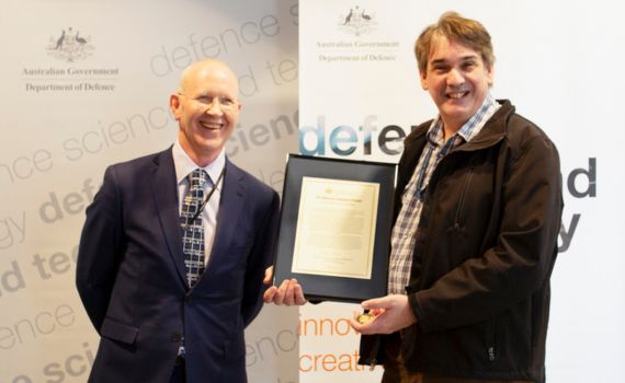 DSTG Chief Dr Greg Bain (left) presents Professor Javaan Chahl with a Defence Commendation acknowledging his valuable partnership with DSTG and Defence.