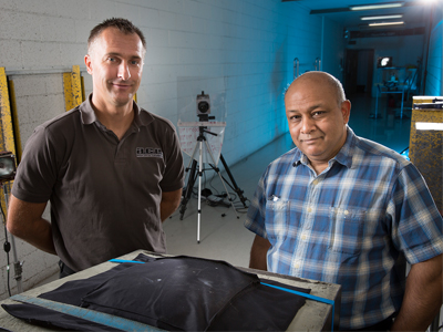 Horace Billon (right) with industry collaborator Adam Fairbairn, testing new ceramic armour prototypes.