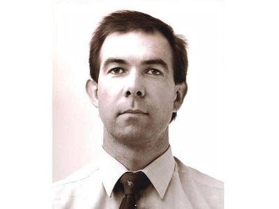 Michael Howlett was killed during an aircraft crash while undertaking his scientific duties. Black and white portrait of Michael Howlett