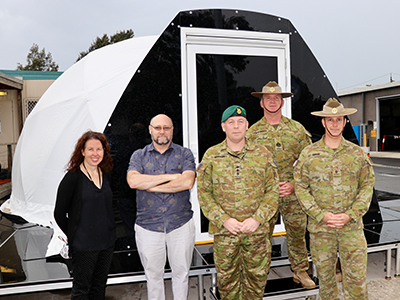 Pictured outside the augmented reality dome (L-R): Melanie Ralph (Discipline Lead Soldier Autonomy), Tim Bussell (Group Leader Integrated Personnel Protection), Colonel Gerald Berson (Director Diggerworks), WO1 Barry Fawcett (RSM Diggerworks), Major Kevin Davis (Program Manager SA Development).