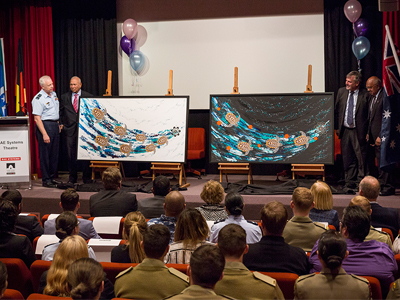 Chief of the Defence Force Air Chief Marshal Mark Binskin, AC, Warrant Officer Class One (Rtd) Roy Mundine, OAM, Chief Defence Scientist Dr Alex Zelinski and Mr Harry Allie unveil the female version of "The Song Cycle of the Seven Sisters" by Artist Anthony Walker during the 'Education as a Life Long Journey' event.