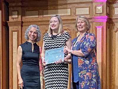 Chief Defence Scientist, Tanya Monro receiving the Athena SWAN Institutional Bronze award.