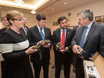 Chief Defence Scientist Dr Alex Zelinsky (right) demonstrates the new counter improvised explosive device (IED) equipment to (from L-R) Senator for Western Australia the Hon Linda Reynolds, Minister for Defence the Hon Kevin Andrews and Ambassador for the Embassy of Afghanistan, H.E Nasir A. Andisha.