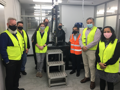 Mr Nicholas Brealey, DSTG; Assoc Prof. Russel Brinkworth, Flinders; Mr Myles Adams, Honours student, Flinders; Dr Andrew Lammas, Flinders; Mr Ashley Johns, Supashock; Prof Karl Sammut, Flinders; Mr Oscar Fiorinotto, Founder & CEO, Supashock; and Prof Giselle Rampersad, Flinders with the shock absorber rig.