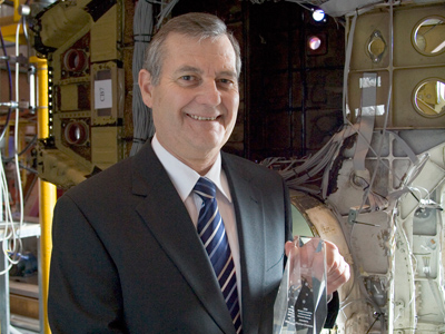 Dr Bruce Hinton with his Minister's aircraft maintenance Award for Achievement in Defence Science.