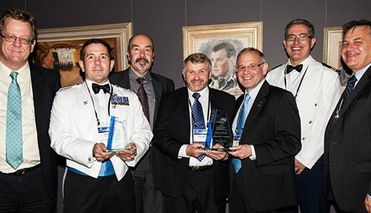 (L-R) Acting Secretary of the Department of Defence, Brendan Sergeant, Captain Carl Bird, Mike Bell (DSTO), Laurie Bird (DMO), Mark Pitt (DSTO), Wing Commander Joe Bennett and CDS Dr Alex Zelinsky. 