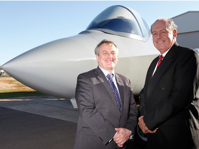 Chief Defence Scientist Dr Alex Zelinsky (left) with Senator the Honourable David Johnston, Minister for Defence in front of the F-35 Iron Bird at the unveiling ceremony. 
