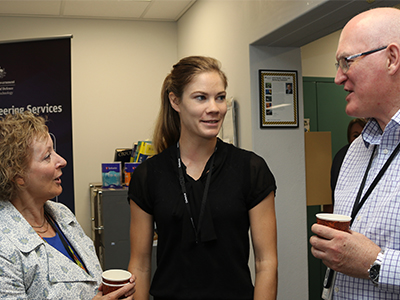 R&I Graduate Monique Hollick (middle) talking with DST Chiefs Dr Janis Cocking and Dr John Riley.