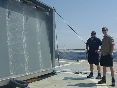 Shannon Keough and Ian Kermonde on the deck of the Greek vessel HS Prometheus, with the Wandjina test article. 