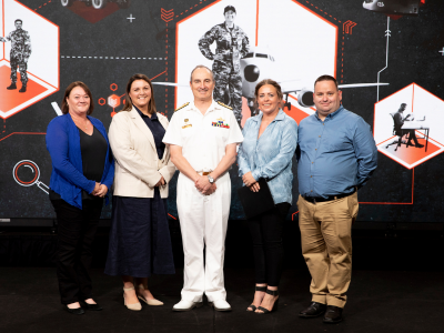 The NAVIGATE Team receives a 2024 VCDF Award from Vice Admiral David Johnston, AC, RAN. Pictured (L-R): Lisa Murdock, Sallyann Salmon, VCDF Vice Admiral David Johnson (presenting), Jessica Brophy and Benjamin Gray.