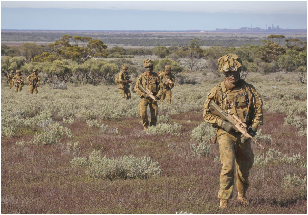 Members from the 1st Brigade, Australian Army, on patrol during Exercise Boars Run at Cultana Training Area. 