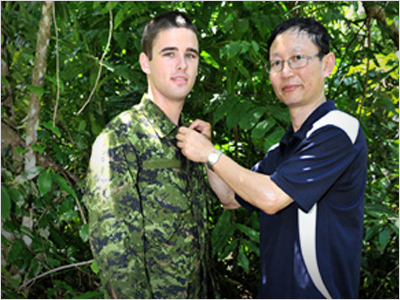 A camouflage uniform is tested by a DSTO scientist.