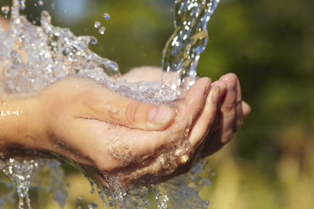 DSTO's scientific analysis of commercial water filters could help reduce the amount of water Australian soldiers need to carry and ease the logistical burdens associated with resupply. An image of water flowing onto cupped hands.