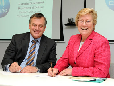 Chief Defence Scientist Dr Alex Zelinksy and CSIRO Chief Executive Dr Megan Clark signing the Strategic Relationship Agreement. A photograph of Chief Defence Scientist Dr Alex Zelinksy and CSIRO Chief Executive Dr Megan Clark signing the Strategic Relationship Agreement.