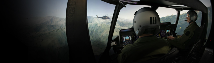 Helicopter pilots use a helicopter flight simulator.