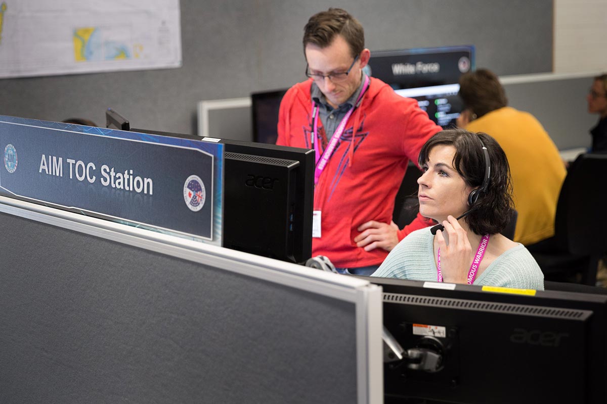 Photo showing Elizabeth Frost working at a computer during Autonomous Warrior 2018.