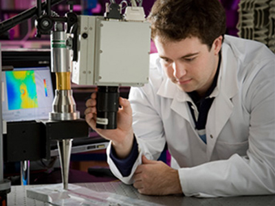 Gain industry experience through our scholarship and placement programs A young scientist operating a microscope