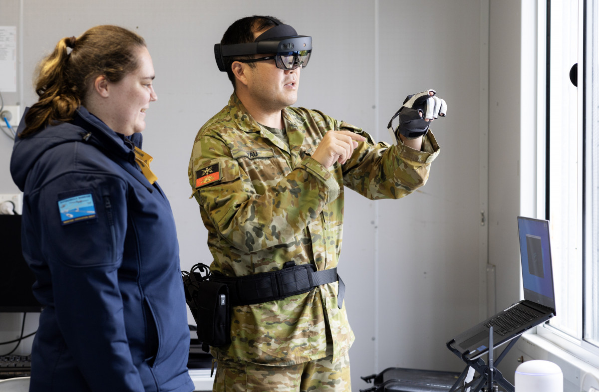 Caitlyn Sims and Major Ivan Yau demonstrate Multimodal Edge 4 (MEC4) during the TTCP AI Strategic Challenge 2023