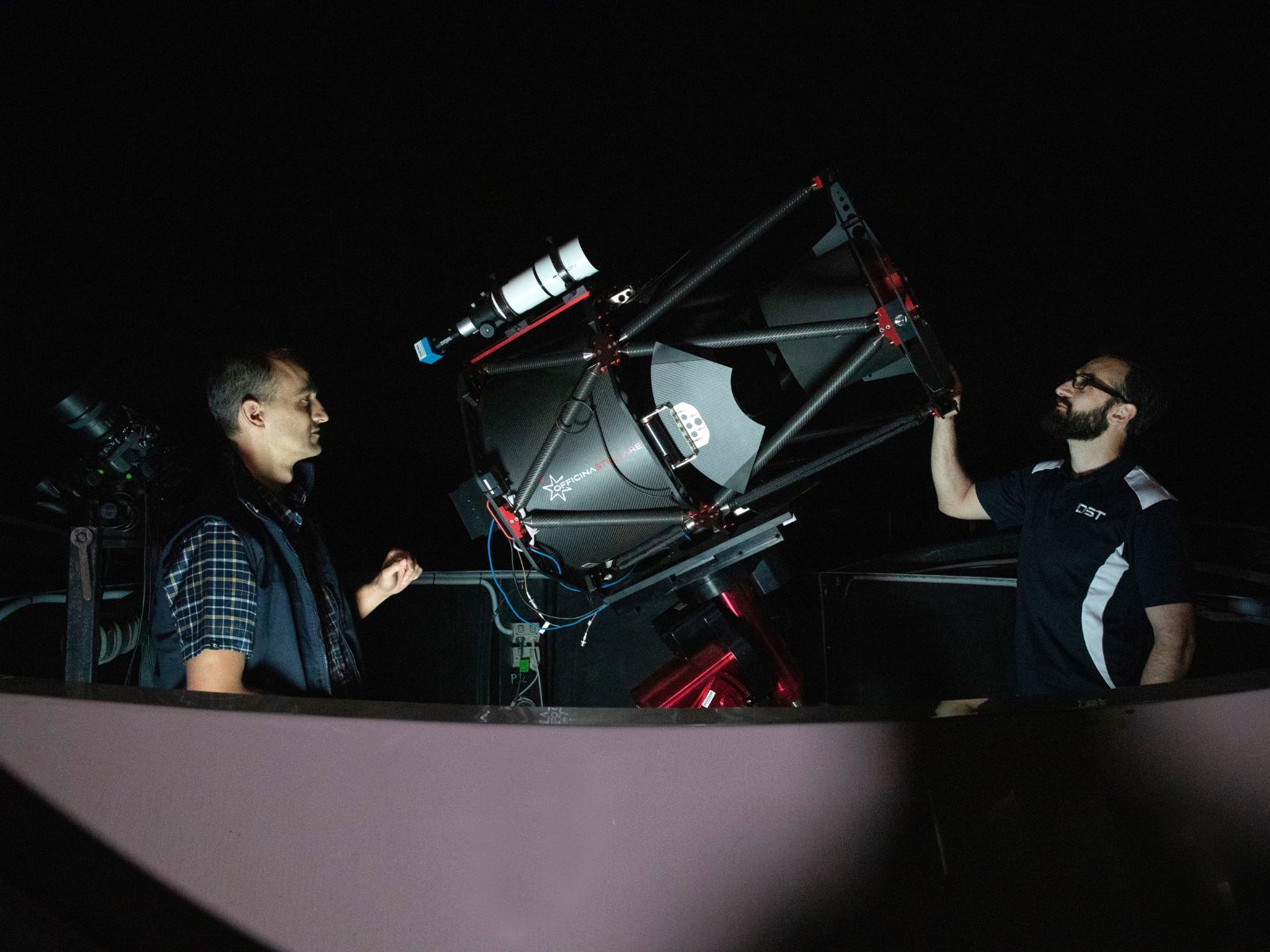 Researchers preparing the DSTG Space Domain Awareness (SDA) Telescope for collecting observations of satellites and debris in orbit around Earth, in preparation for a Sprint Advanced Concept Training exercise. The research instruments allow training, testing of new hardware, algorithm development and collaborative research with industry, academia and research organisations in Australia and overseas.