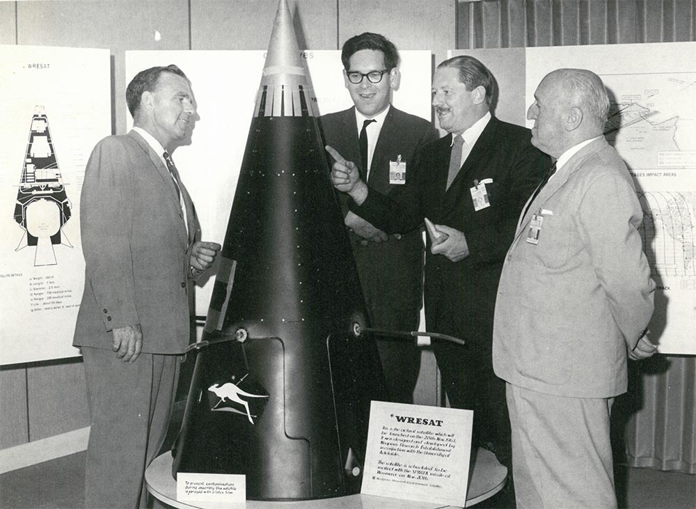 L to R: Des Barnsley (WRE), Prof John Carver (University of Adelaide), Bryan Rolfe and D Woods (WRE) inspect WRESAT. Photo courtesy of Prof John Carver.