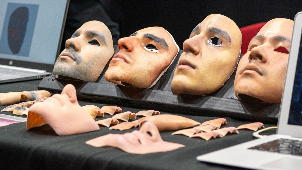 The final version of masks 3D-printed in colour by industry partner Fusetech, with components printed earlier in the research. The masks of final-year engineering students (L-R): Fouad, Luke, Michael and Sebastian were realistic enough to trick facial recognition algorithms.