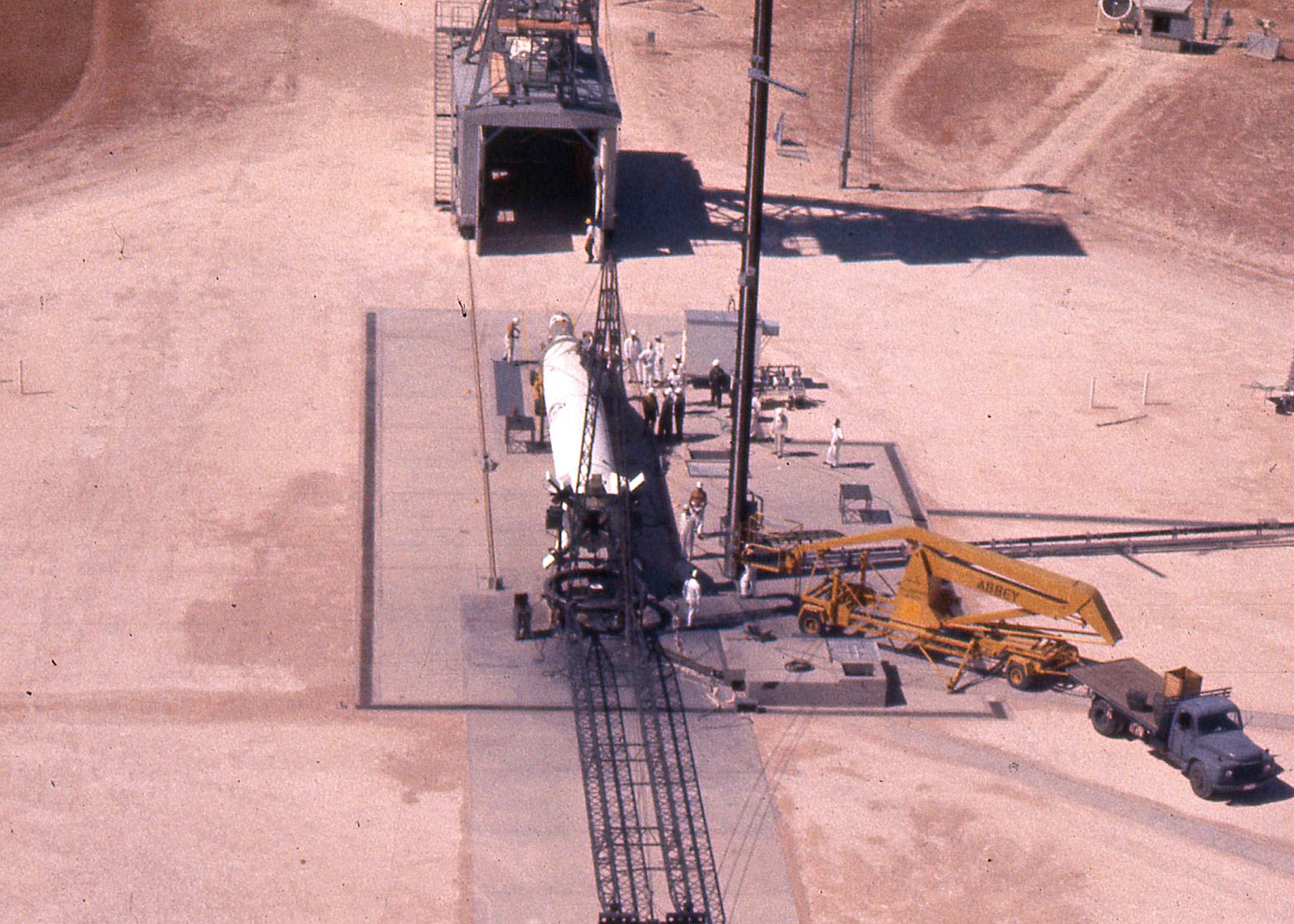 The Redstone rocket prior to its being lifted to the vertical position for launch at Woomera. The rocket was painted white for optical tracking purposes and the satellite attached while the Redstone rocket was still in the horizontal position. Photo courtesy of Prof John Carver.