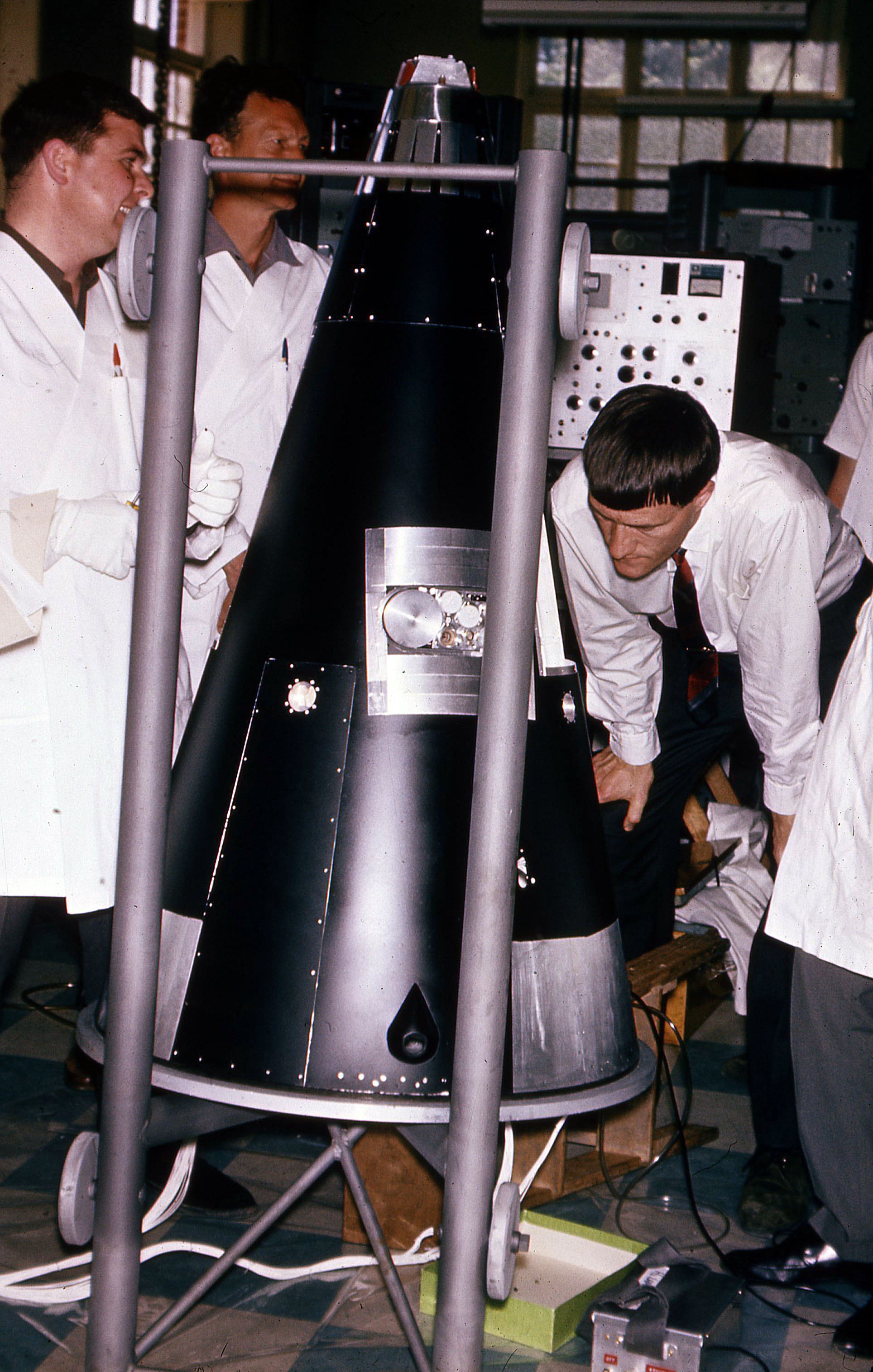 Assembling and inspection of WRESAT at the University of Adelaide before shipment to Woomera. Photo courtesy of Prof John Carver.