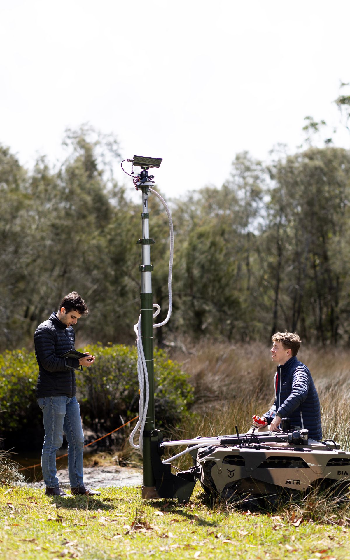 Matthew Lakis and Thomas Nash demonstrate the War Fighter UGV during the Technical Cooperation Program AI Strategic Challenge 2023 at HMAS Creswell, Jervis Bay Territory.