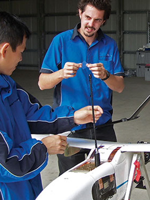 DST Group and Army personnel with the Australian-developed unmanned aerial vehicle, Aerosonde.