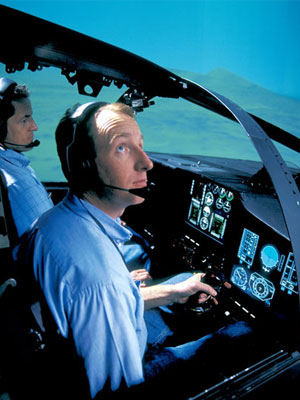 A photograph of a pilot taking part in an ALR 2002 radar warning reciever flight simulation 