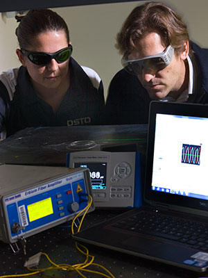 Two DST Group experts working on fibre laser sensors.