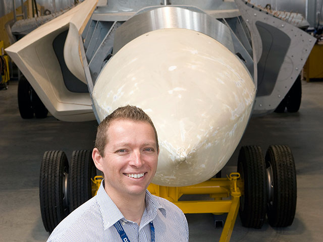 Dr Andrew Walters standing in front of DSTO's 'Iron Bird'