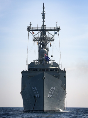 HMAS Sydney at anchor near Pulau Tioman, Malaysia during Exercise BERSAMA SHIELD 2014.