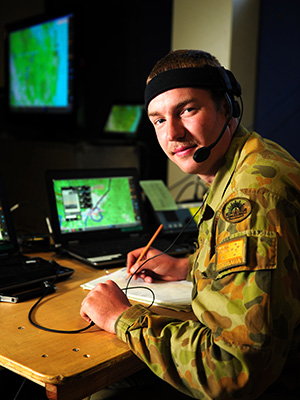 Australian Army soldier Signaller Liam McInerney of the 7th Combat Signals Regiment, monitors the battle management system in the joint operations room during Exercise Talisman Saber 2013, Queensland. 