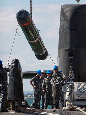 A Submarine Launched Countermeasure Emulator (SLACE) vehicle is embarked onto HMAS Collins from Diamantina Pier at HMAS Stirling, WA.