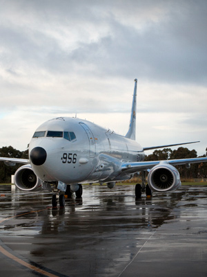 A Poseidon P-8A aircraft on a runway.