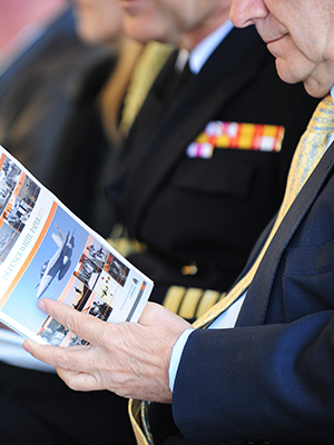 An image of a man reading the Defence White Paper.