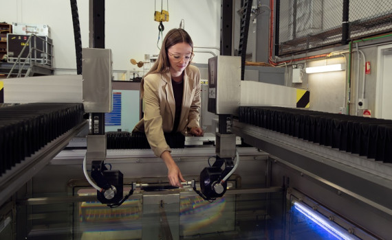 Defence scientist Hannah Spratling adjusts a probe on DSTG’s immersion scanner, prior to conducting non-destructive testing of material samples. 