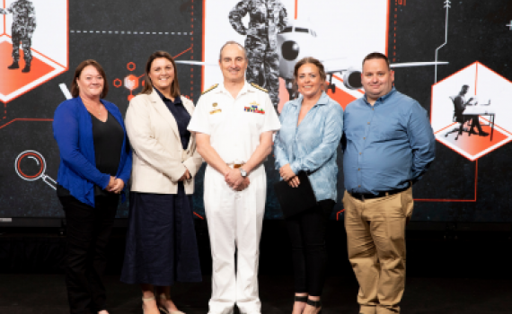 The NAVIGATE Team receives a 2024 VCDF Award from Vice Admiral David Johnston, AC, RAN. Pictured (L-R): Lisa Murdock, Sallyann Salmon, VCDF Vice Admiral David Johnson (presenting), Jessica Brophy and Benjamin Gray.