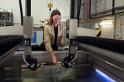 Defence scientist Hannah Spratling adjusts a probe on DSTG’s immersion scanner, prior to conducting non-destructive testing of material samples. 