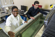 Dr Chirima (left) and fellow researcher Dr Matthew Ibrahim with DSTG’s ultrasonic immersion system which is able to measure the speed of sound, transmission loss and reflection coefficients of Dr Chirima’s material samples which are immersed in the water.