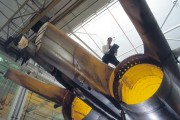 A photograph of a scientist assessing an F-111 airframe.