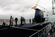 A photograph of HMAS Farncomb being fitted with the pickups for accoustic imaging trials.