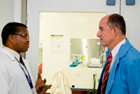 A DST Group scientist providing advice to the Assistant Minister for Defence, Mr Stuart Robert.
