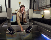 Defence scientist Hannah Spratling adjusts a probe on DSTG’s immersion scanner, prior to conducting non-destructive testing of material samples. 